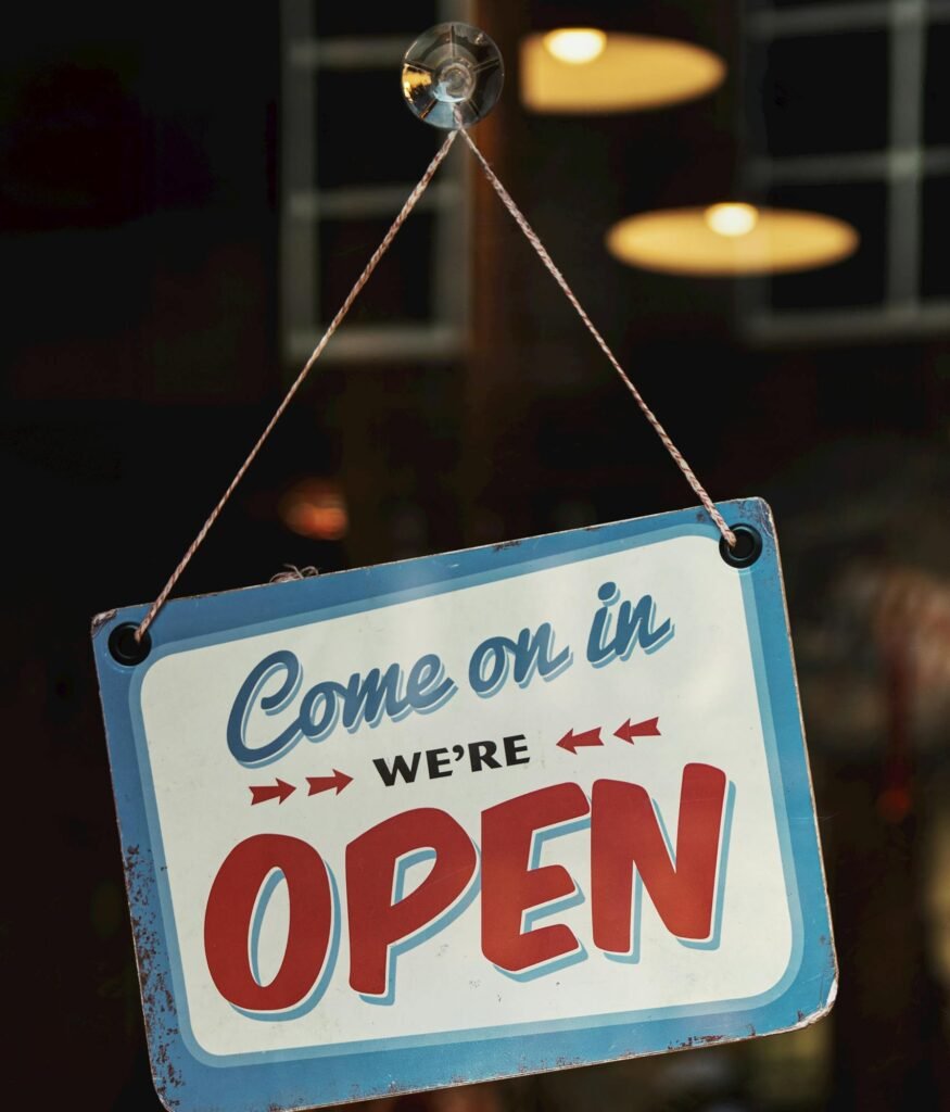 Vintage-style open sign welcoming customers into a Nashville shop. Perfect for illustrating business atmosphere.